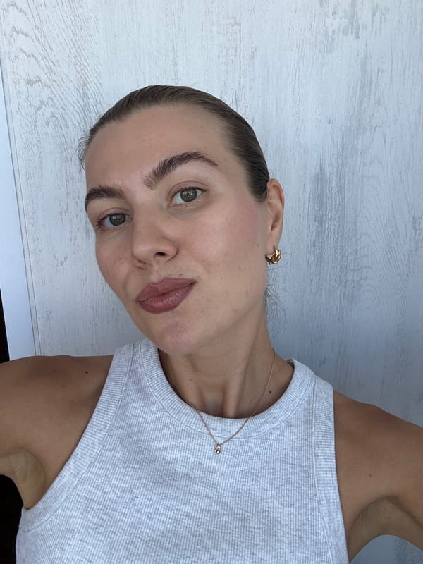 Close-up selfies against a pale wood-paneled wall