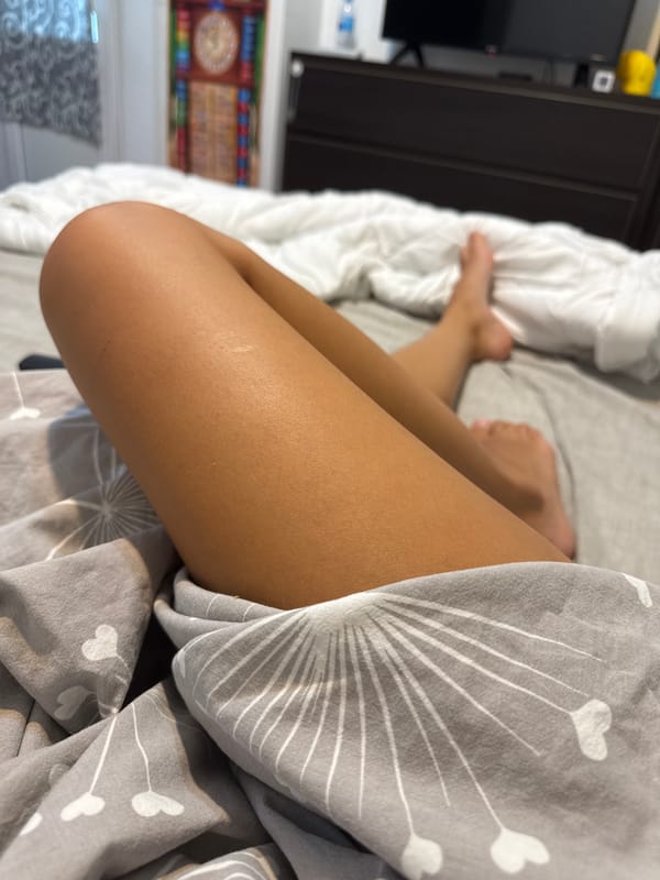 Relaxing on patterned sheets in a Chișinău bedroom