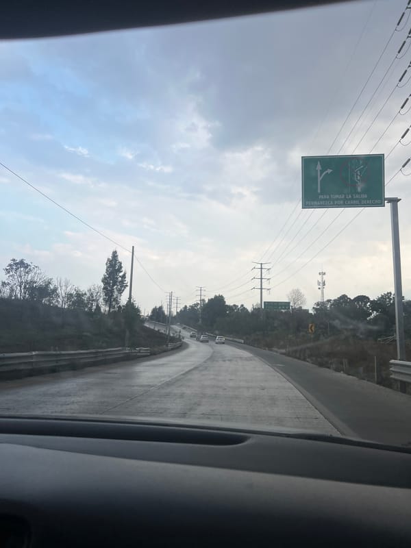 Nighttime drive through Cholula captured on highway exit