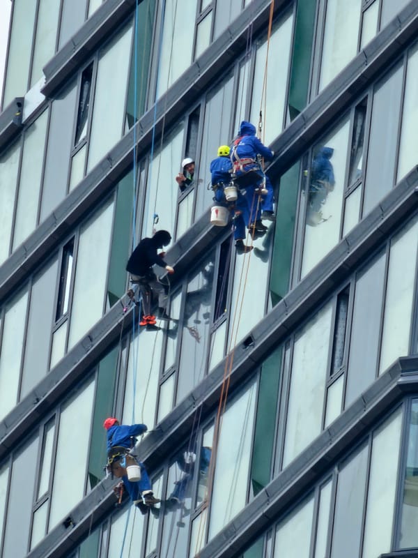 Window washers clean Moscow high-rise building exterior