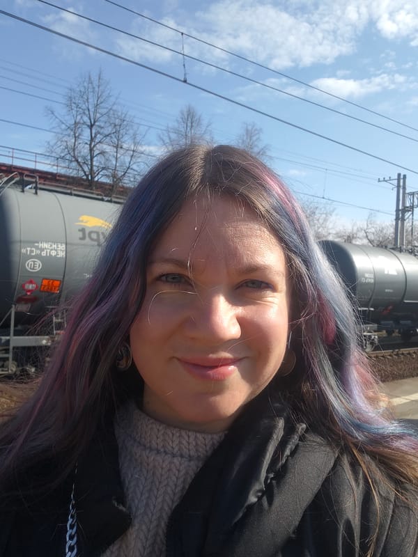 Woman with colorful hair photographed at Yakhroma railway station