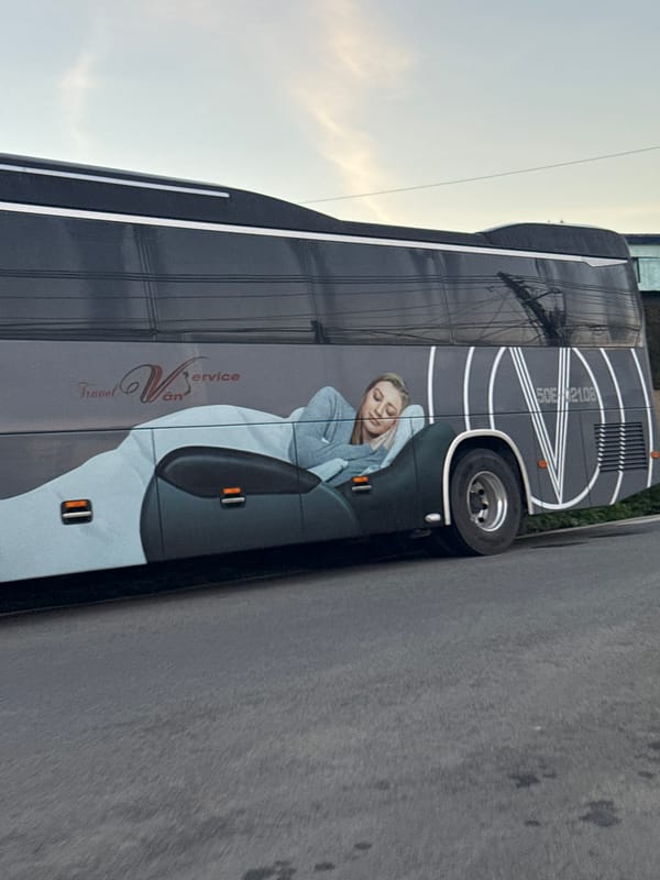Evening scenes in Đà Lạt: a bus ad and a tea ceremony setup
