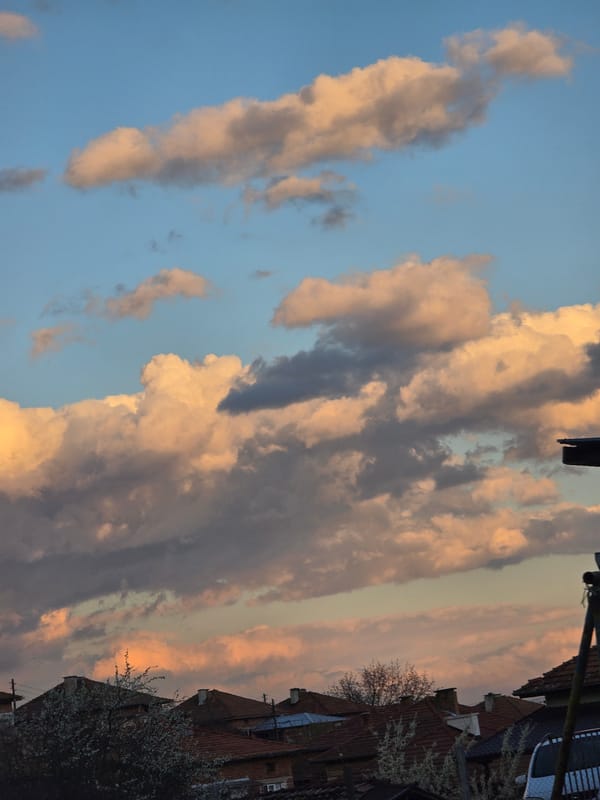 Sunset illuminates clouds over Bulgarian countryside near Borovo