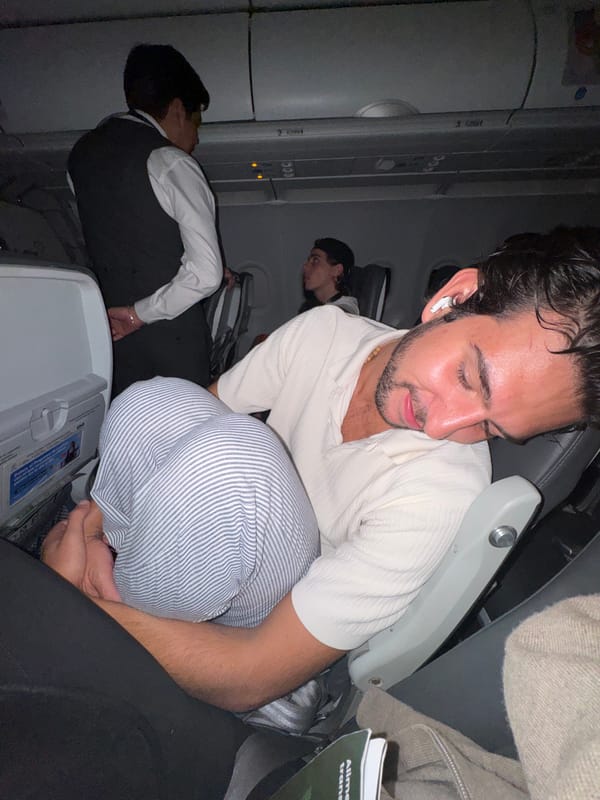 Late night flight passengers rest during Puerto Escondido journey