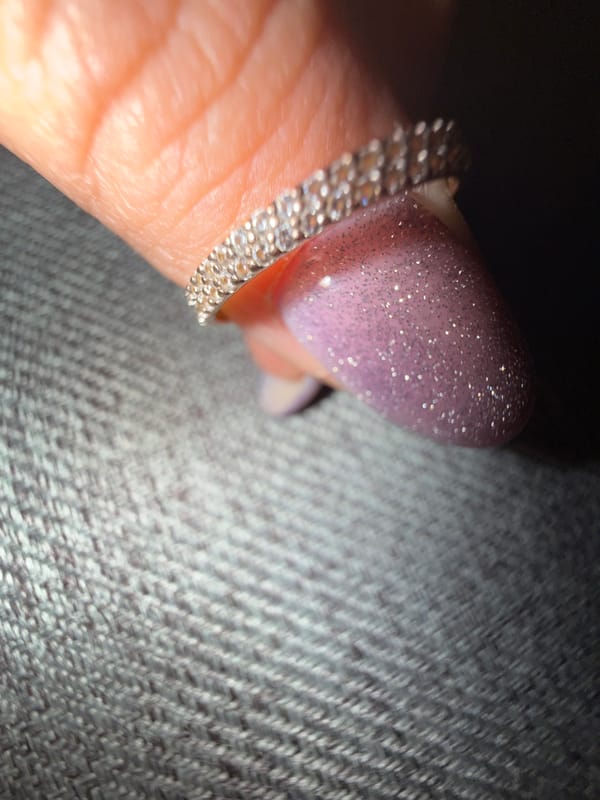 Personal photos captured in Dmitrov show individual with jewelry