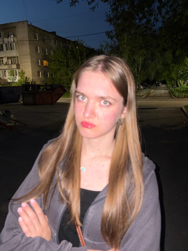 Woman takes evening selfies in residential Perm, Russia