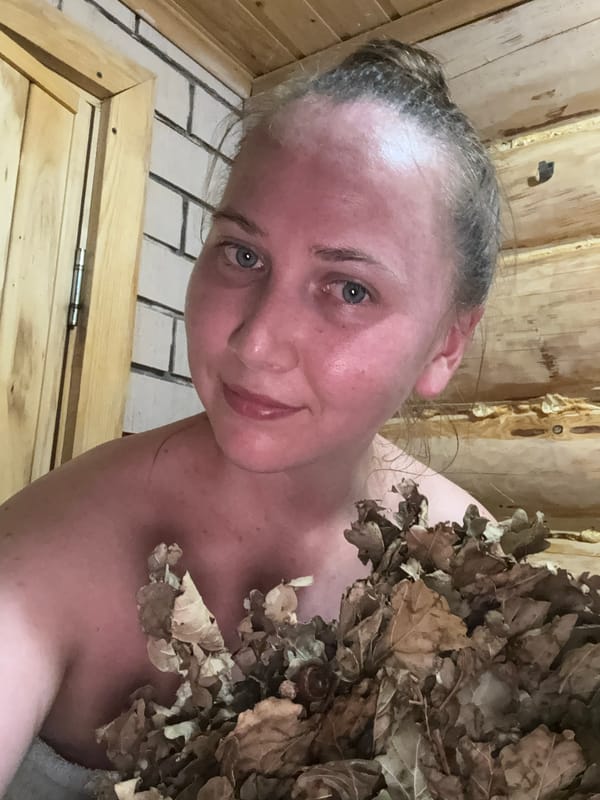 Woman enjoys traditional Russian banya sauna session in Tyulyuk