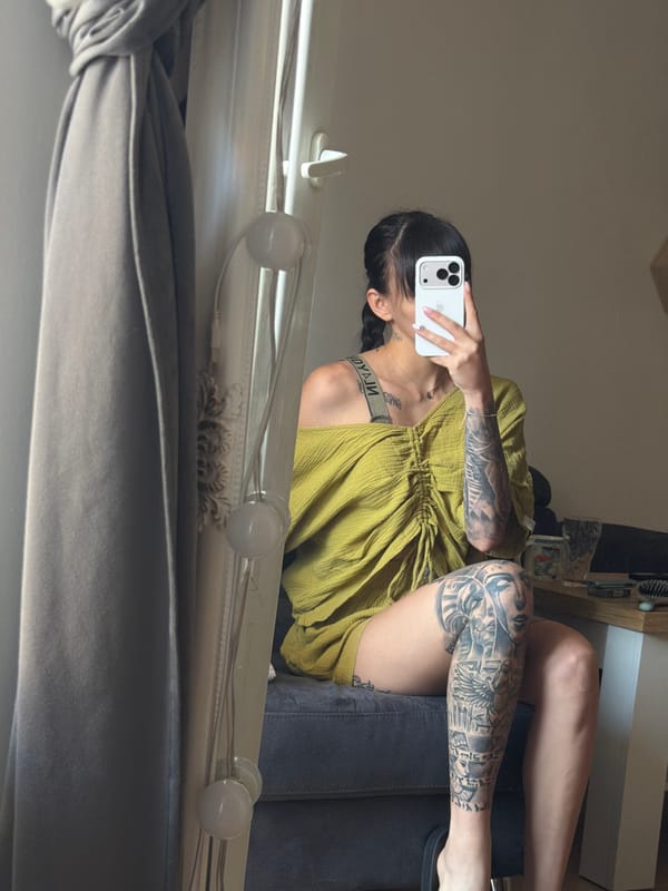 Tattooed woman conducts morning photo session in Plovdiv apartment