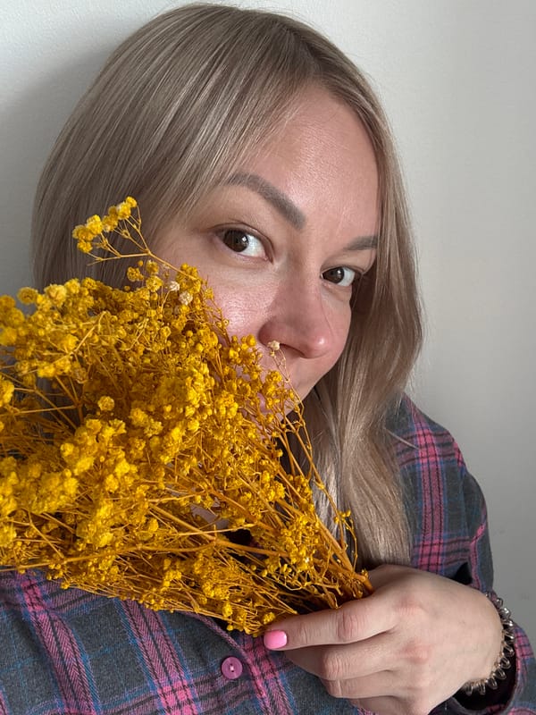 Woman poses with yellow flower bouquet in Izhevsk