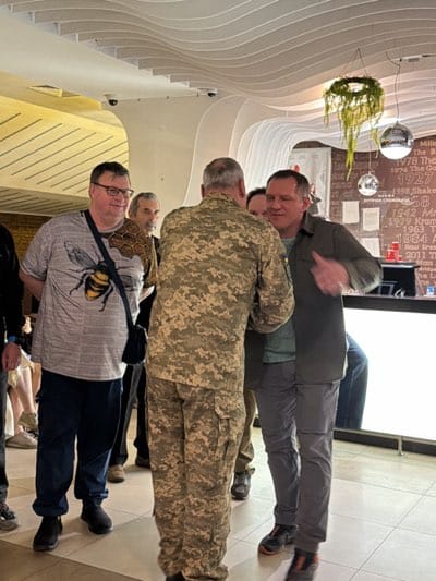 Military-civilian meeting documented indoors in Kyiv