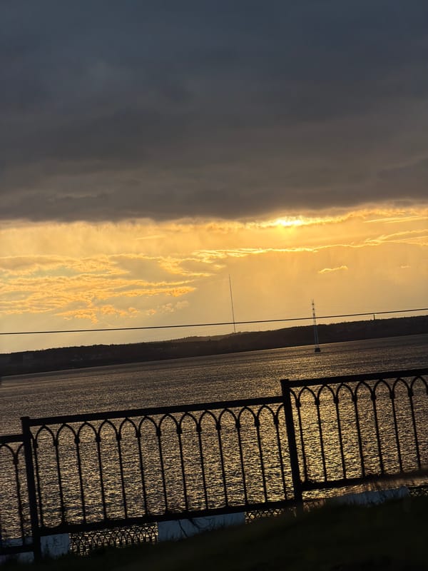 Golden sunset captured over water body in Izhevsk, Russia