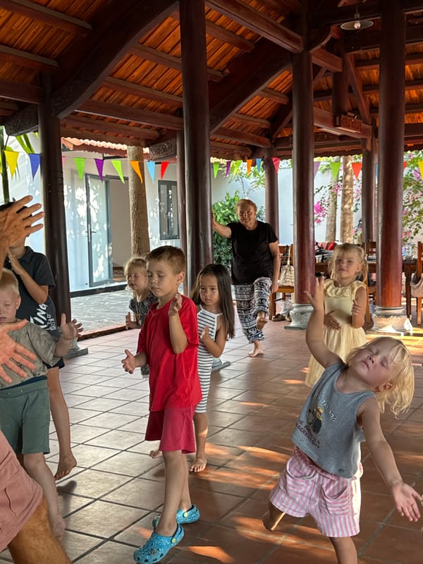 Children participate in group dance activities in Mũi Né