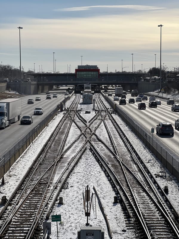 Chicago railway tracks and bridge walkways show snow cover