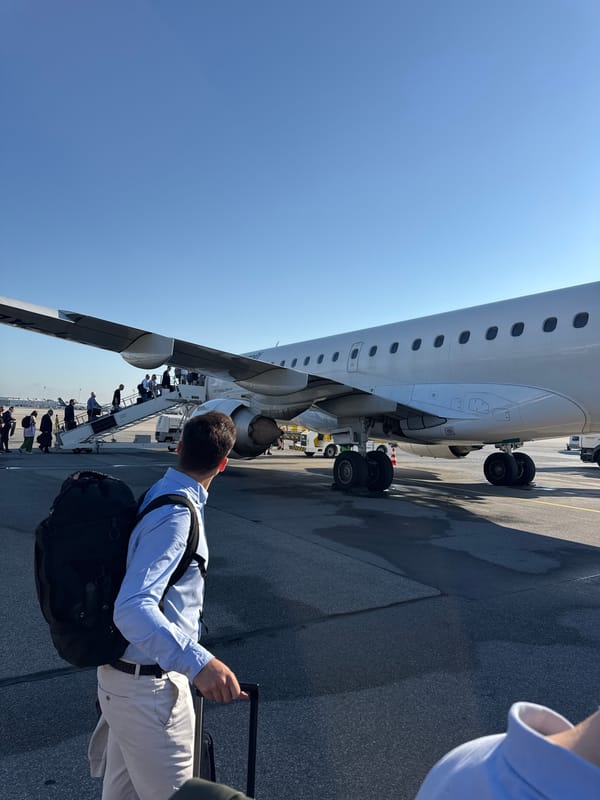 Boarding via mobile stairs on a sunny Oberding tarmac.