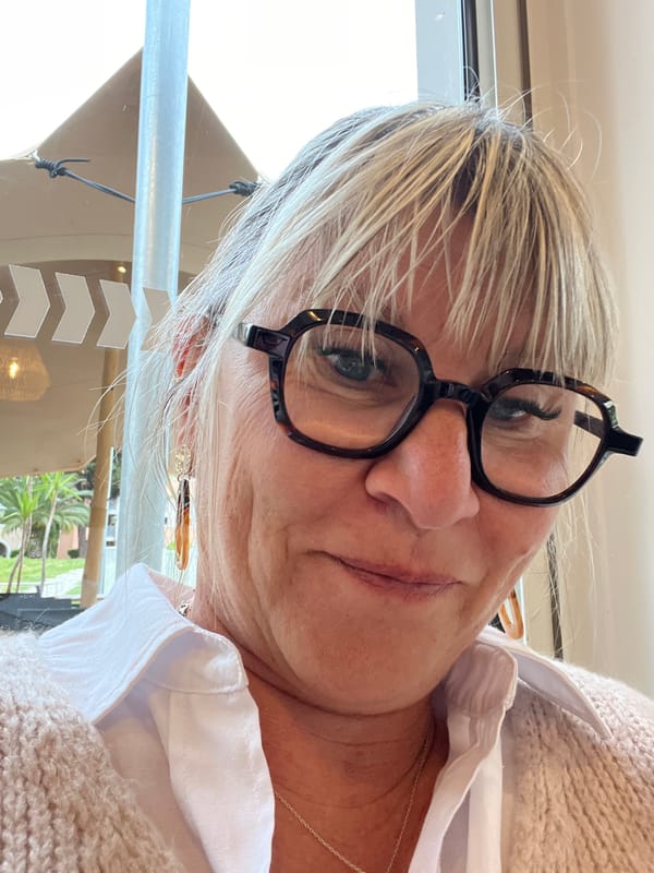 Woman enjoys breakfast in Grimaud, France morning