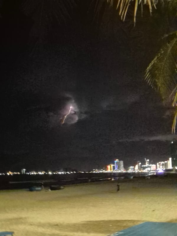 Night out on Đà Nẵng beach: beanbags, coconuts, and a storm offshore