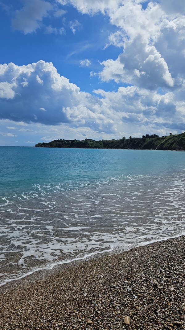 Sunny coastal scenes captured at Rhodes pebble beach