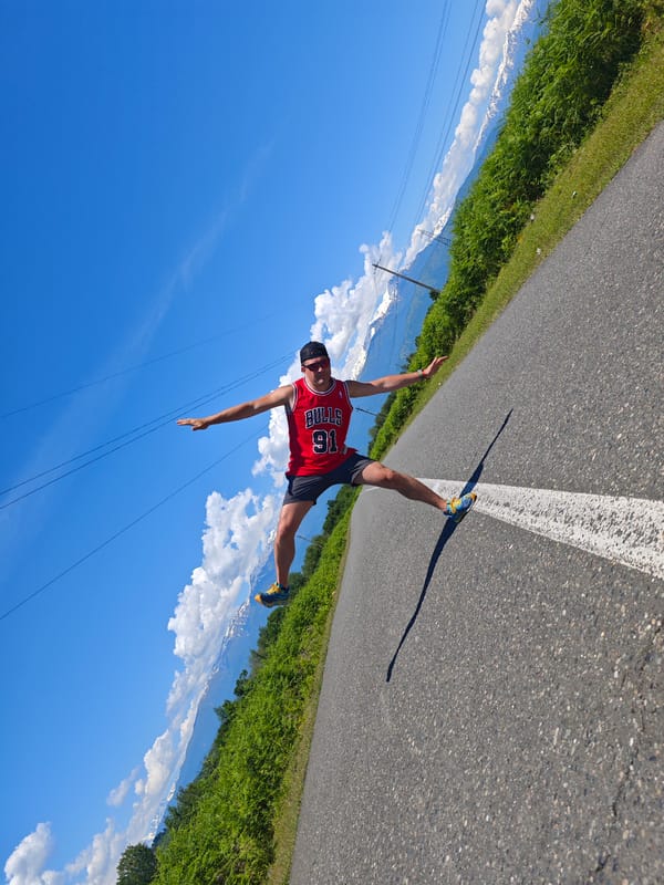 Woman poses, walks on mountain road in Abkhazia