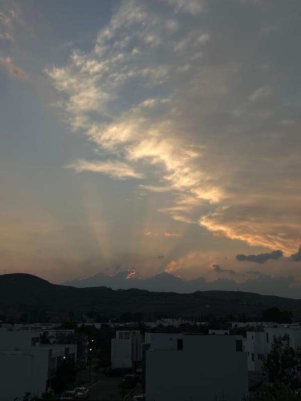 Dramatic sunbeams pierce clouds over Santa Clara Ocoyucan, Mexico