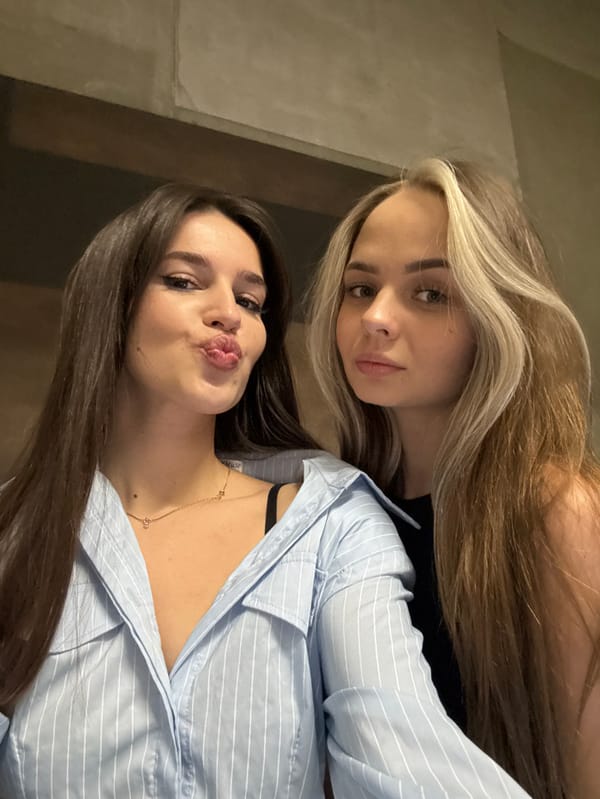 Two women take selfies during Moscow photo session