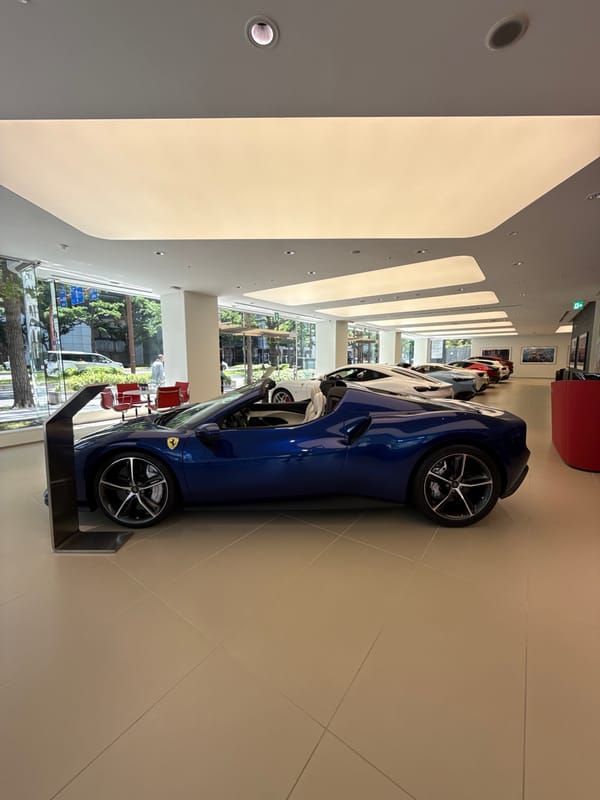 Ferrari dealership showcases luxury sports cars in Osaka showroom