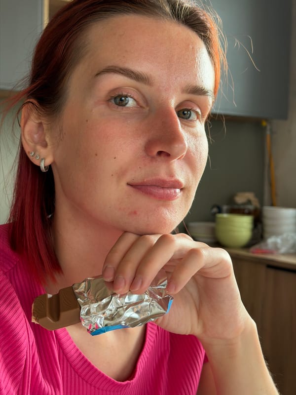 Woman enjoys chocolate bar and coffee in Chaikovsky