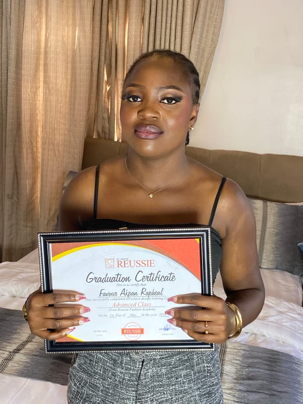 Woman celebrates fashion design graduation in Gura Top, Nigeria