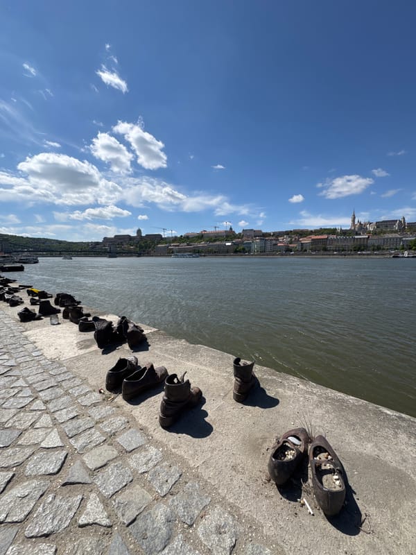 Visitors document Holocaust memorial along Budapest's Danube riverbank