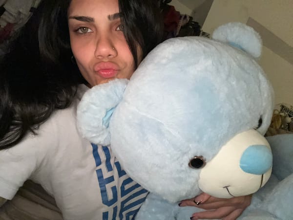 Woman cuddles with stuffed bear in Buenos Aires