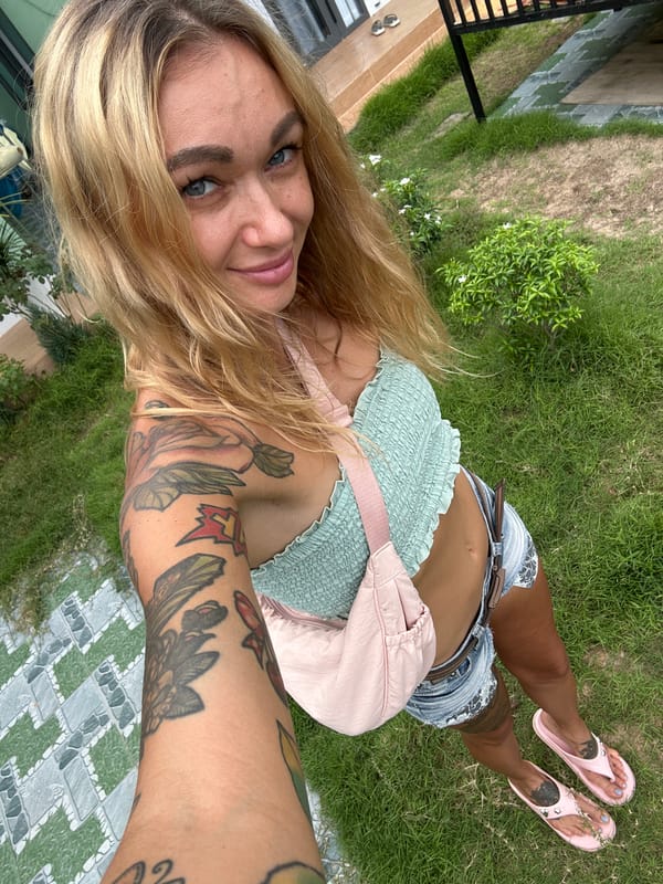 Woman takes outdoor selfies in Mũi Né, Vietnam