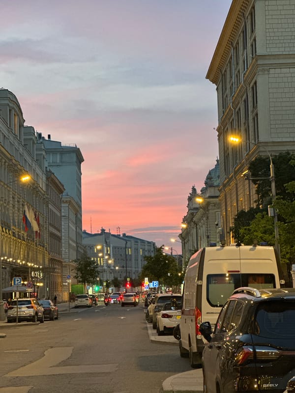Moscow street at dusk, Budapest Hotel lit up at twilight