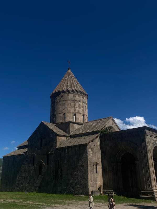 Visitor documents Tatev Monastery's architecture and religious artwork