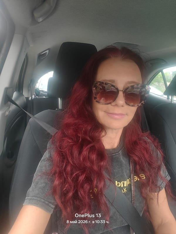 Woman with red hair spotted in car wearing seatbelt