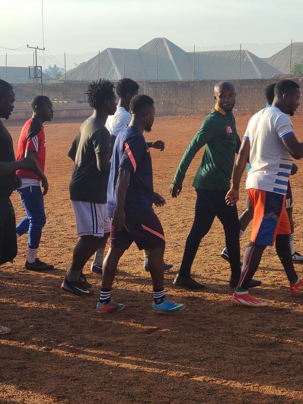 Young men conduct morning football training in Nigeria