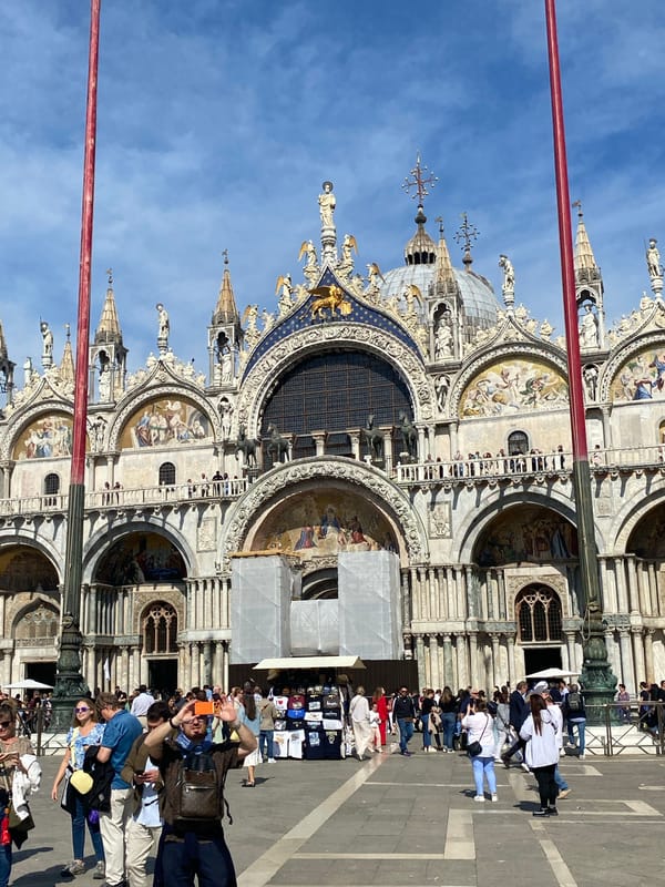 Tourists feed pigeons, take selfies in Venice's St. Mark's Square