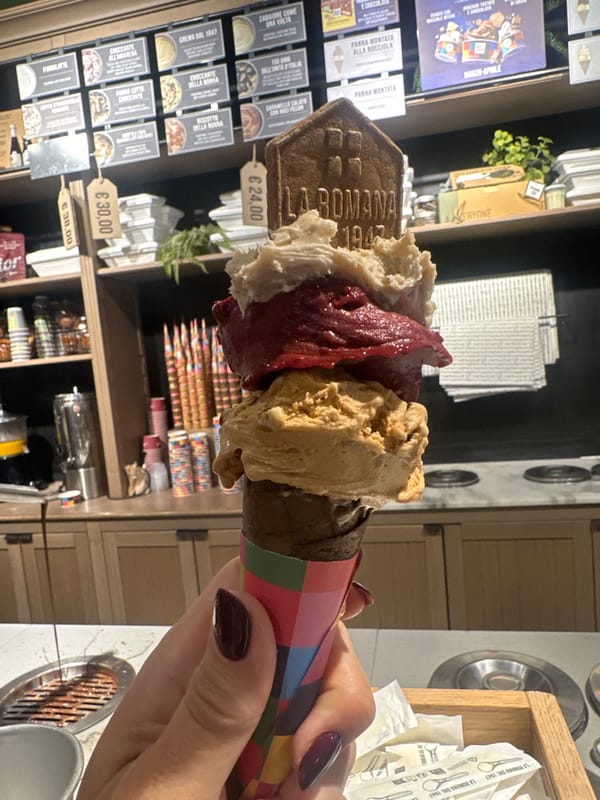 Customer enjoys gelato at Turin's Gelateria La Romana