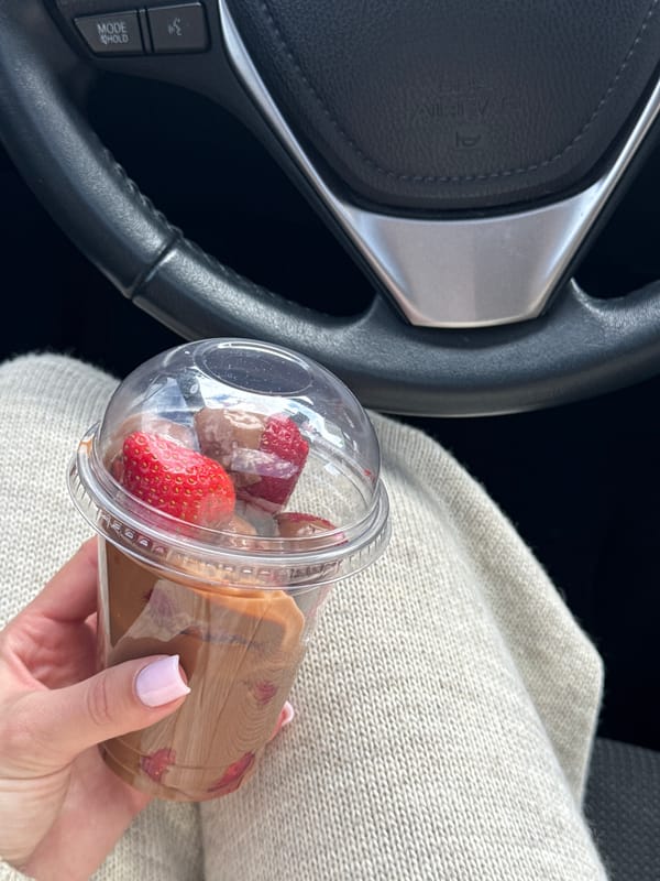 Driver enjoys strawberry chocolate treat in Kyiv vehicle