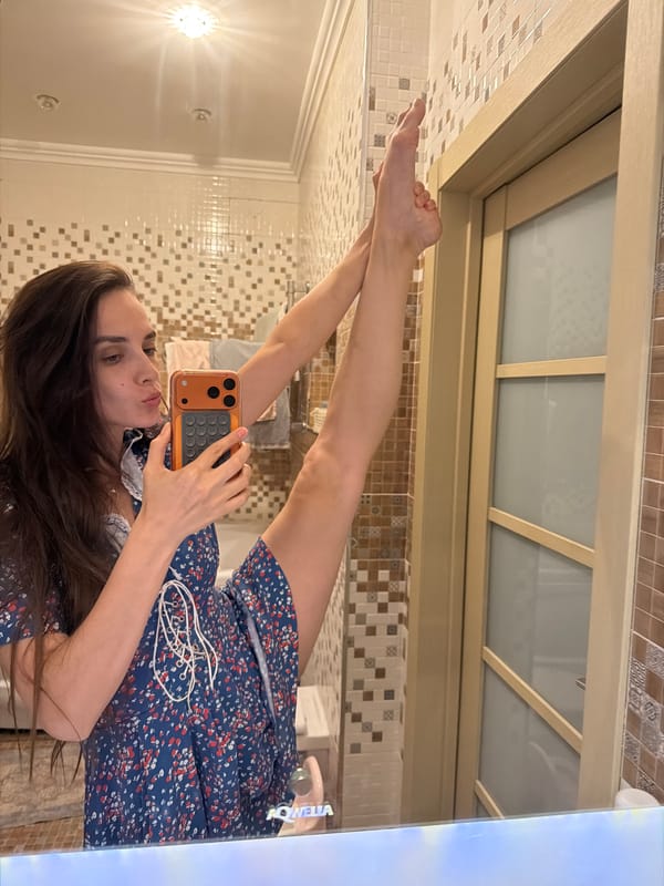 Mirror selfie session in a blue floral dress