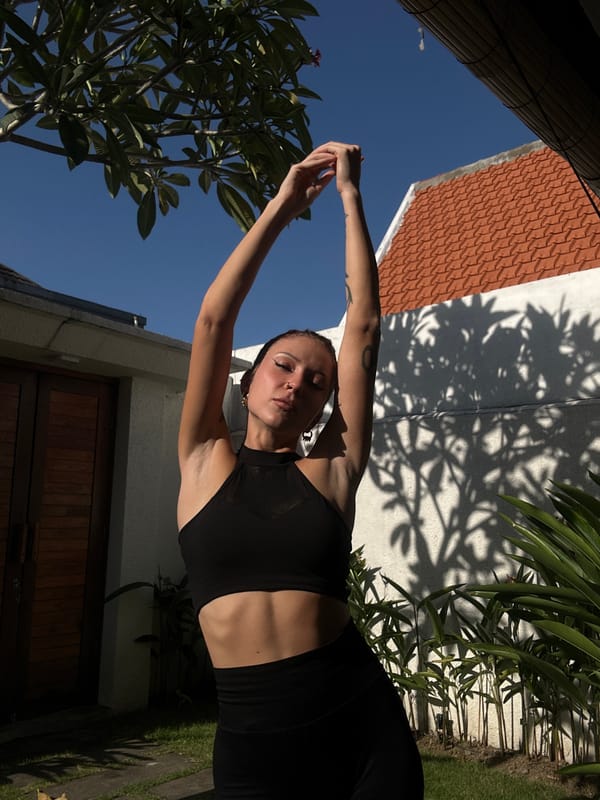 Woman exercises outdoors in athletic wear in North Kuta