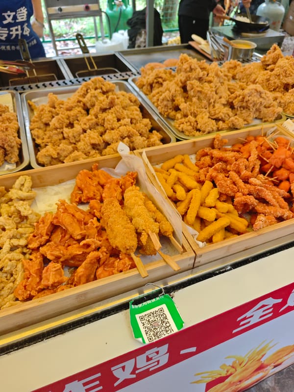 Food vendor displays fried items in Shapingba District