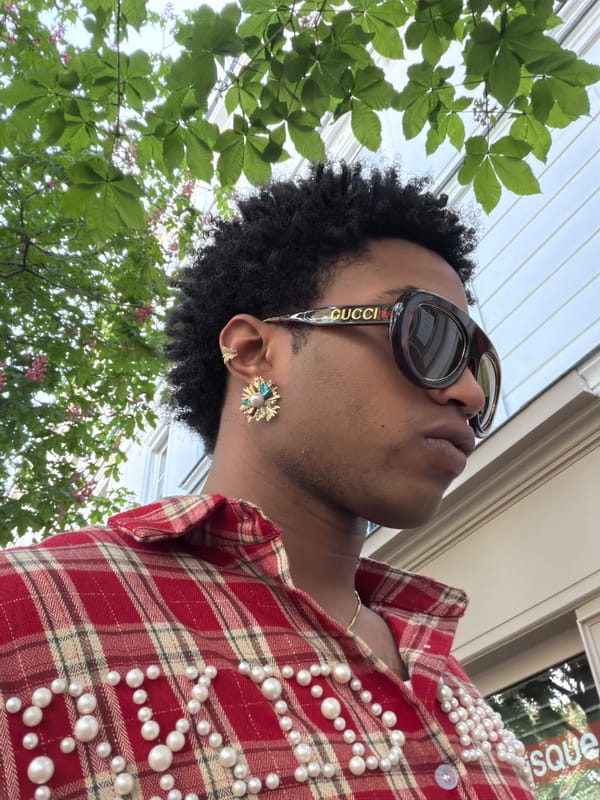 Fashion-forward individual spotted wearing Gucci accessories in central Paris