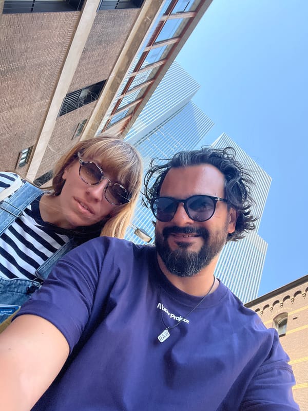 Sunny afternoon selfies against Rotterdam's modern skyline