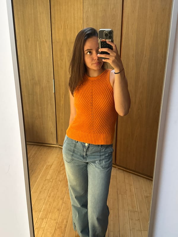 Woman takes mirror selfie in Mexican home