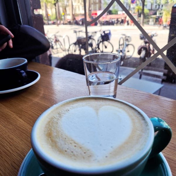 Coffee break captured at Strasbourg cafe with street view