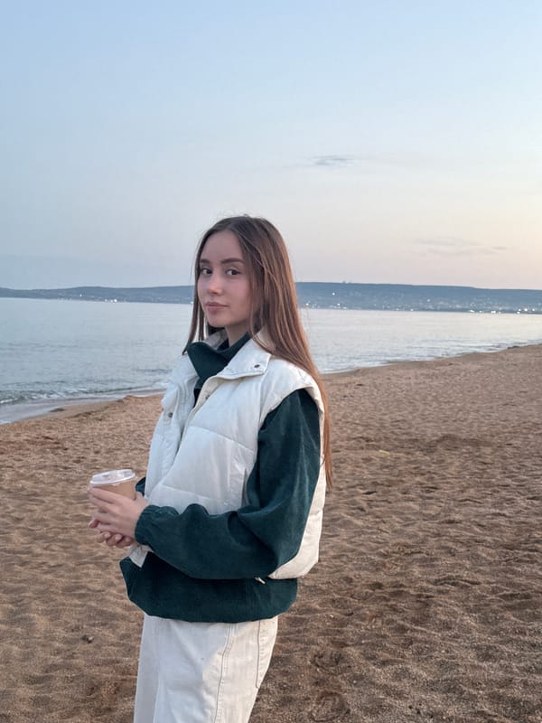 Woman with cup observed on Ukrainian beach