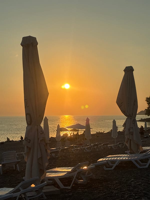 Black Sea beach winding down at golden hour, Sochi