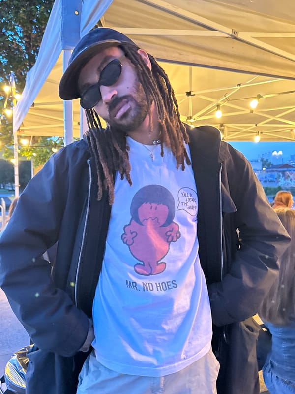 Festival attendee spotted at outdoor Paris event under tent