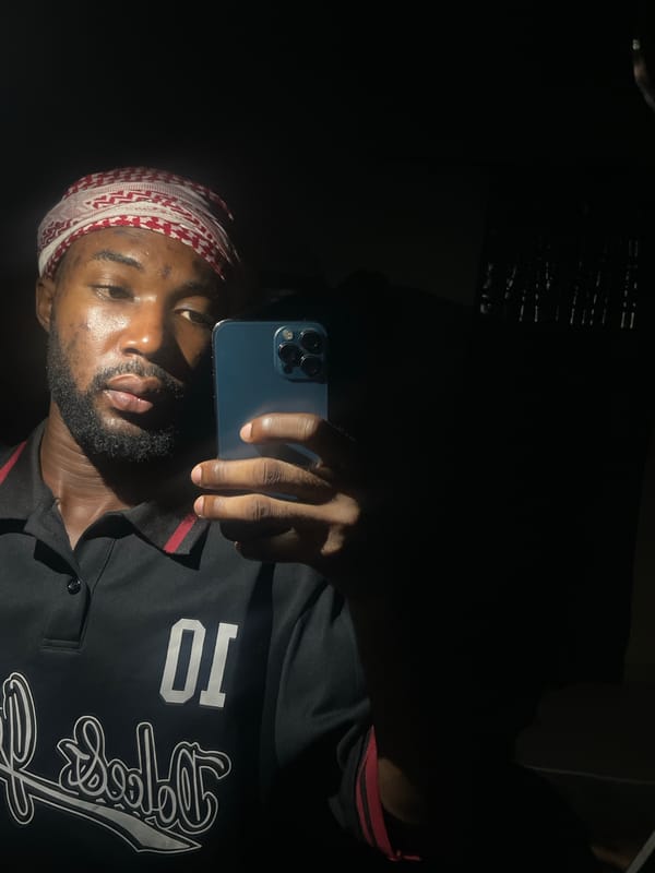 Man takes selfies in dark setting in Lokoja, Nigeria