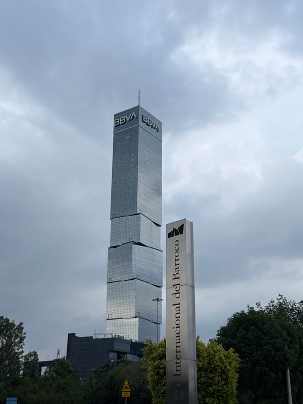 Modern towers photographed in Puebla metro area under overcast skies
