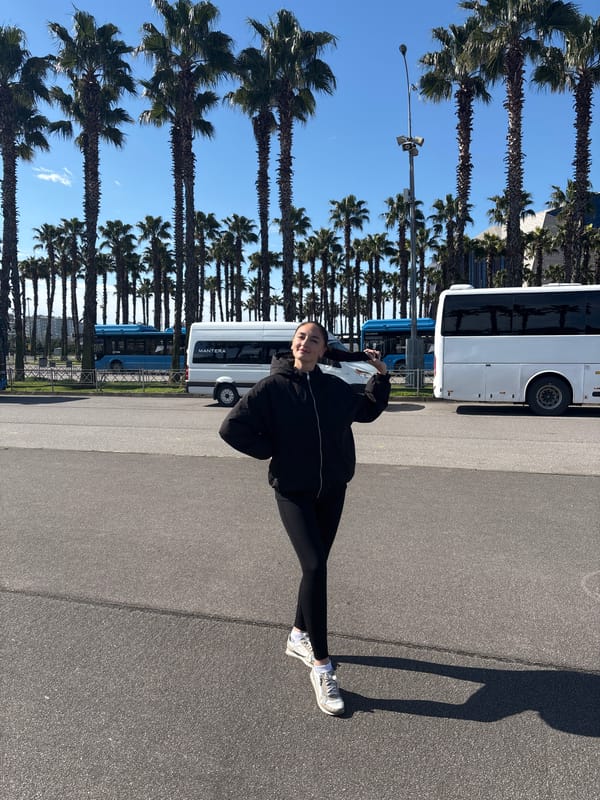 Morning walk captured near palm trees in Sirius, Russia